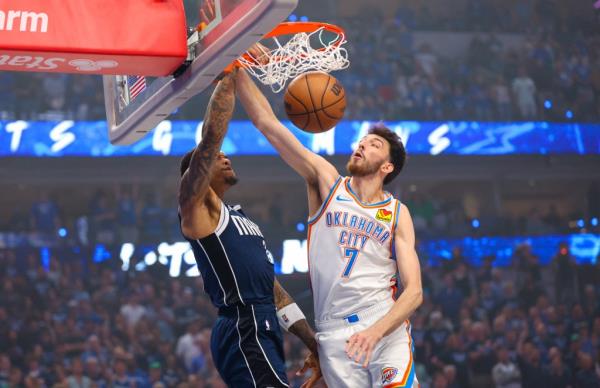 Dallas Mavericks forward P.J. Washington (25) dunks past Oklahoma City Thunder forward Chet Holmgren (7) during the first quarter during game three of the second round for the 2024 NBA playoffs at American Airlines Center.