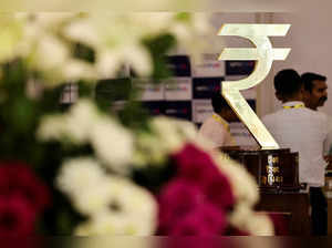 FILE PHOTO: FILE PHOTO: The Indian Rupee logo is seen inside the Reserve Bank of India (RBI) headquarters in Mumbai